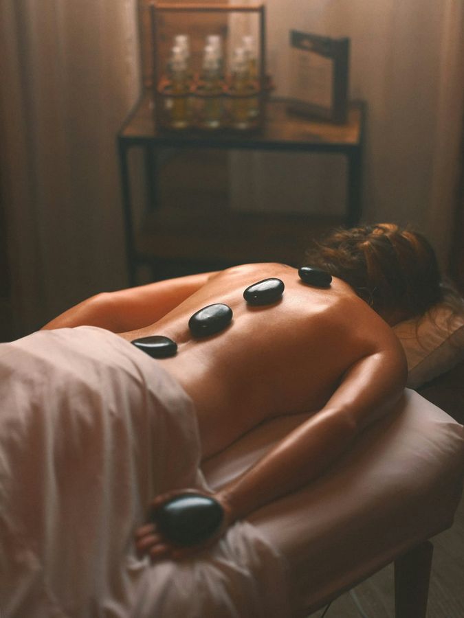 Guest receiving an Adriatic hot stone massage